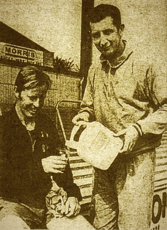 Skipper Nobby Lawton has his energy drink poured by manager Freddie Goodwin