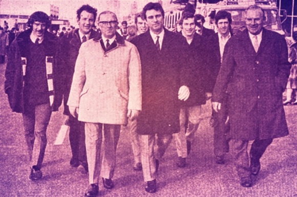 Club officials and players lead the sponsored walk: Kit Napier, Terry Williams, Mr Tom Whiting (Chairman), Peter Dinsdale, Pat Saward (Manager), Norman Gall, Alex Sheridan, Mr Len Stringer (Director).