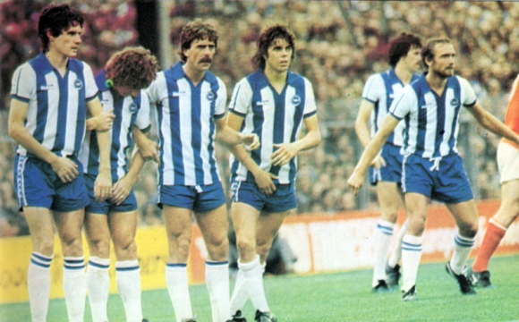 Mark Lawrdnson has just fouled Liam Brady... and nervous Brighton form the inevitable wall.