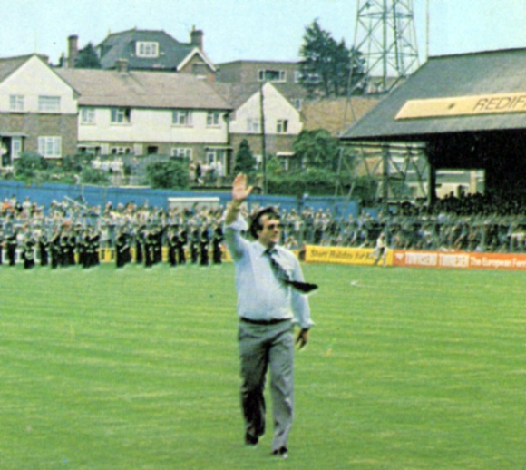 Striking up the band... Alan Mullery salutes the Goldstone crowd before the match. Despite their vociferous support, Albion failed to deliver any points on their big day.